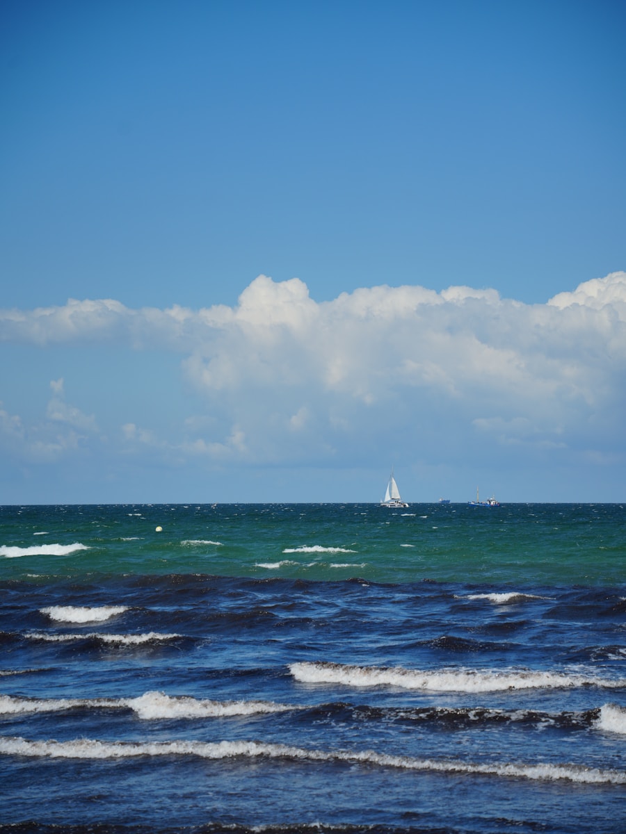 A sailboat in the ocean on a sunny day