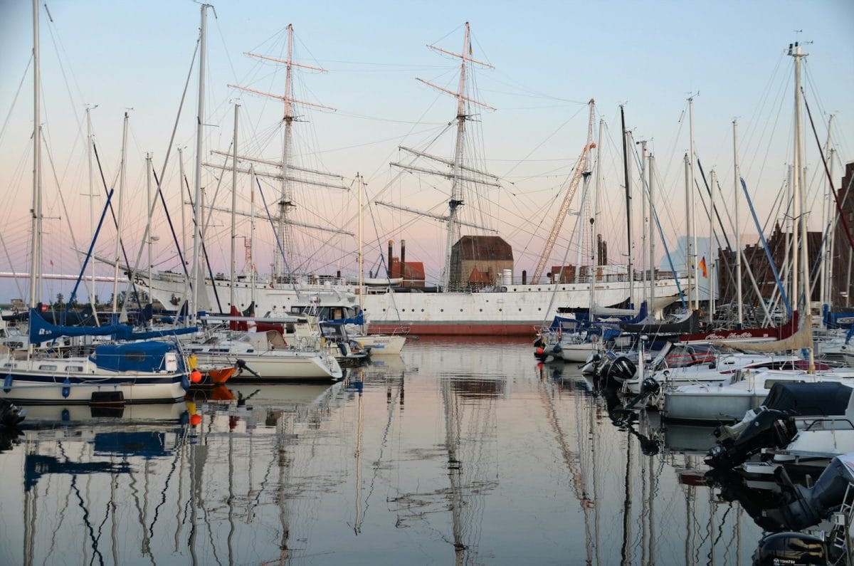 a group of boats that are sitting in the water